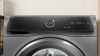 Стиральная машина Bosch Serie 8 WNC254ARSN пан.англ. класс: D загр.фронтальная макс.:10.5кг (с сушкой) серый